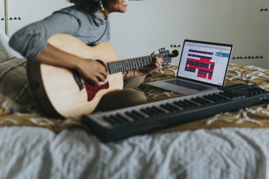 man-in-gray-t-shirt-playing-guitar.jpg man in gray t-shirt playing guitar
